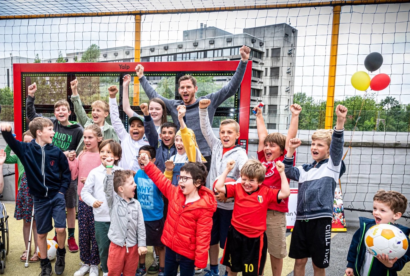 Jan Vertonghen celebrating with children at a Jan Vertonghen Foundation playground